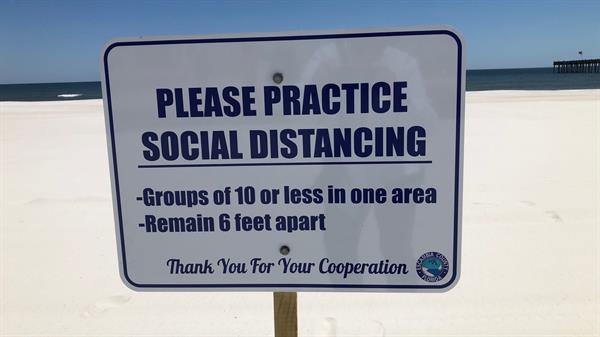 beach sign social distancing 