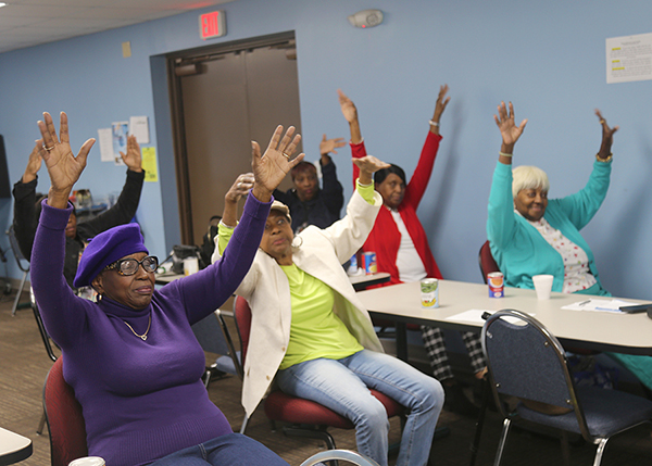 The Brownsville Silver Seniors participate in chair exercises