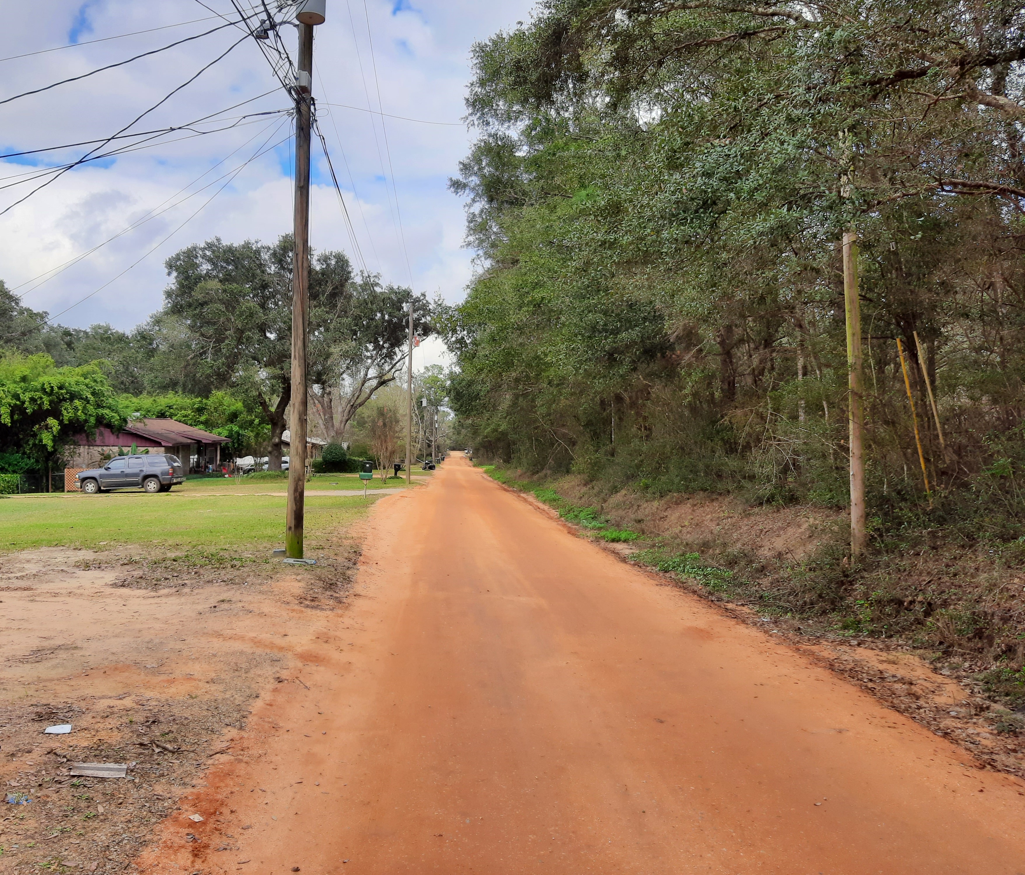 photo of red clay road before paving