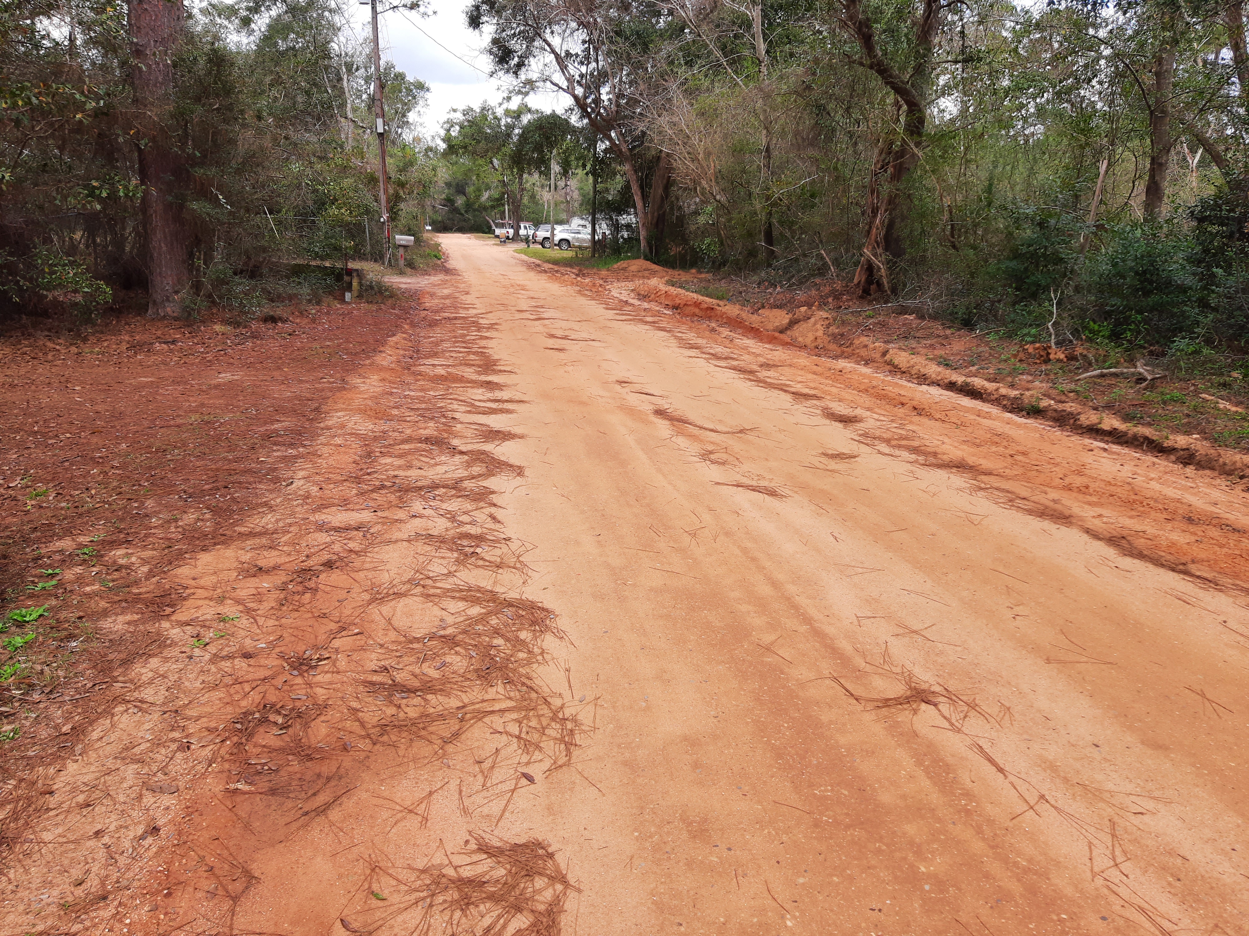 photo of red clay road before paving