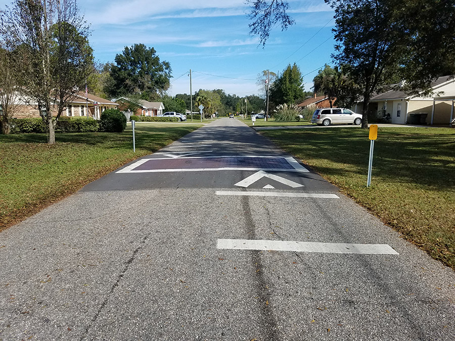 New speed bump indicators and crosswalk