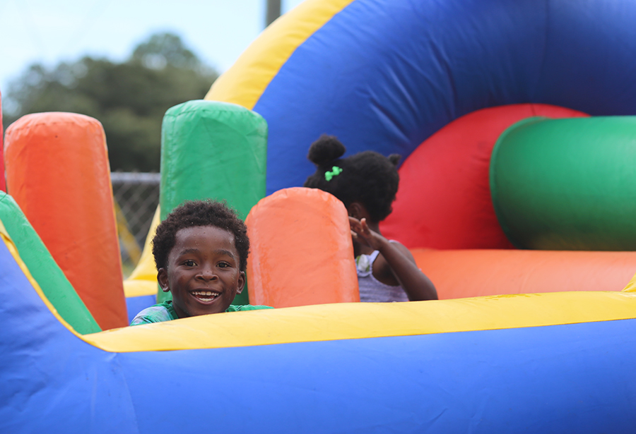A child on the water slide at a county summer fun day