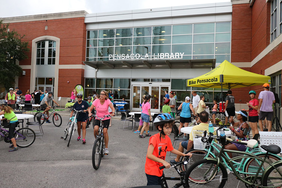 Bicyclists in front of the Pensacola Library for the Slow Ride event.