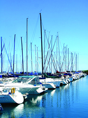 Boat_Harbor_2 small Boats sit in a harbor on a sunny day.