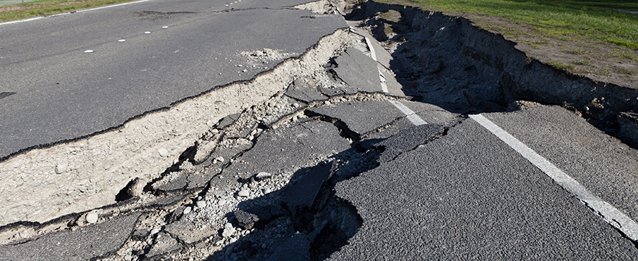 A cracked roadway after an earthquake.