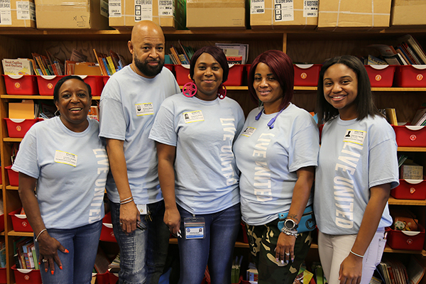 Escambia County Corrections staff organize textbooks at Sherwood Elementary School as part of the 2018 United Way Day of Caring. 