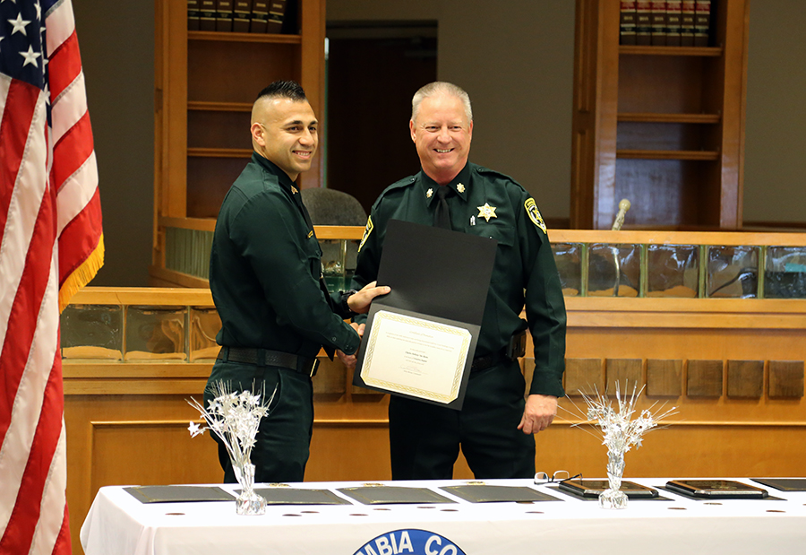 Maj. Greg Nash hands out awards during the Aug. 22 Corrections Staff Award Ceremony
