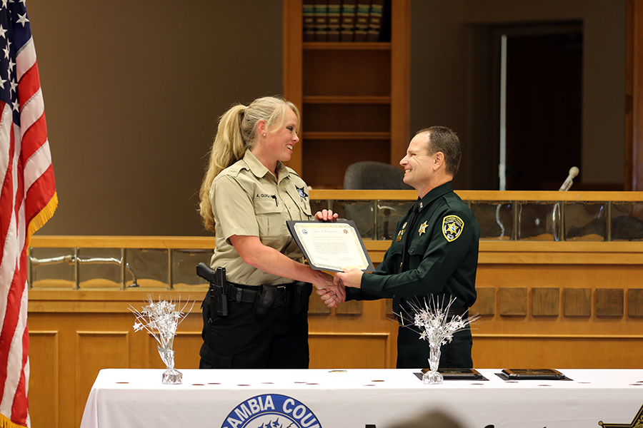 1st Lt. Jason Walker congratulates award recipients at the Aug. 22 Corrections Staff Award Ceremony