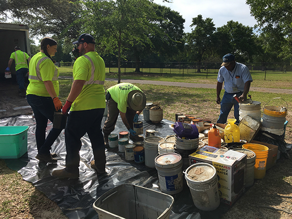 Staff organizes household hazardouse waste collected during the West Barrancas Neighborhood Cleanup