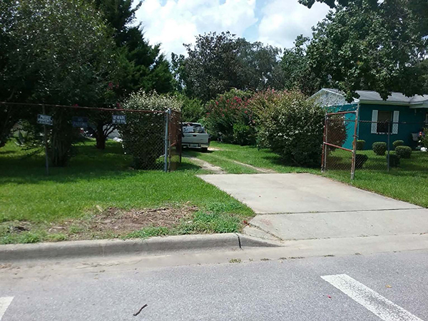 Photo showing a clean curb after items were picked up during the Ebonwood Neighborhood Cleanup.