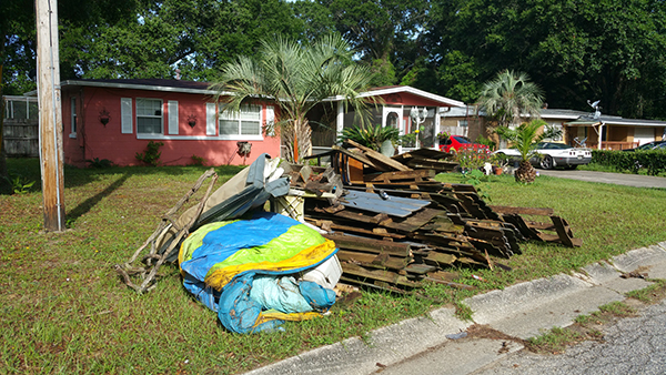 Mayfair North Cleanup 1 Trash was left at the curb to be picked up during the Mayfair North Neighborhood Cleanup on June 13, 2018. More than 23 tons of debris was collected during the cleanup.