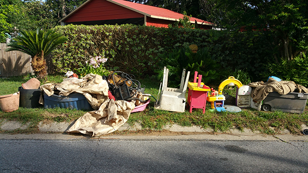 Trash was left at the curb to be picked up during the Mayfair North Neighborhood Cleanup on June 13, 2018. More than 23 tons of debris was collected during the cleanup.