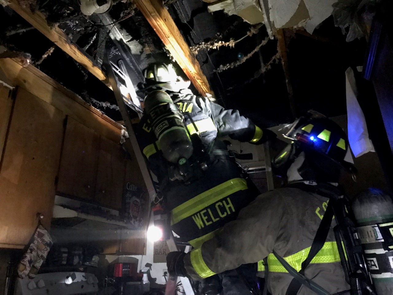 Firefighters in the roof of the home.