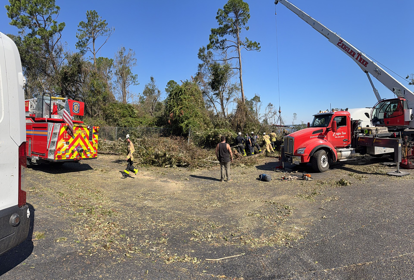 First responders rescue someone on an embankment 