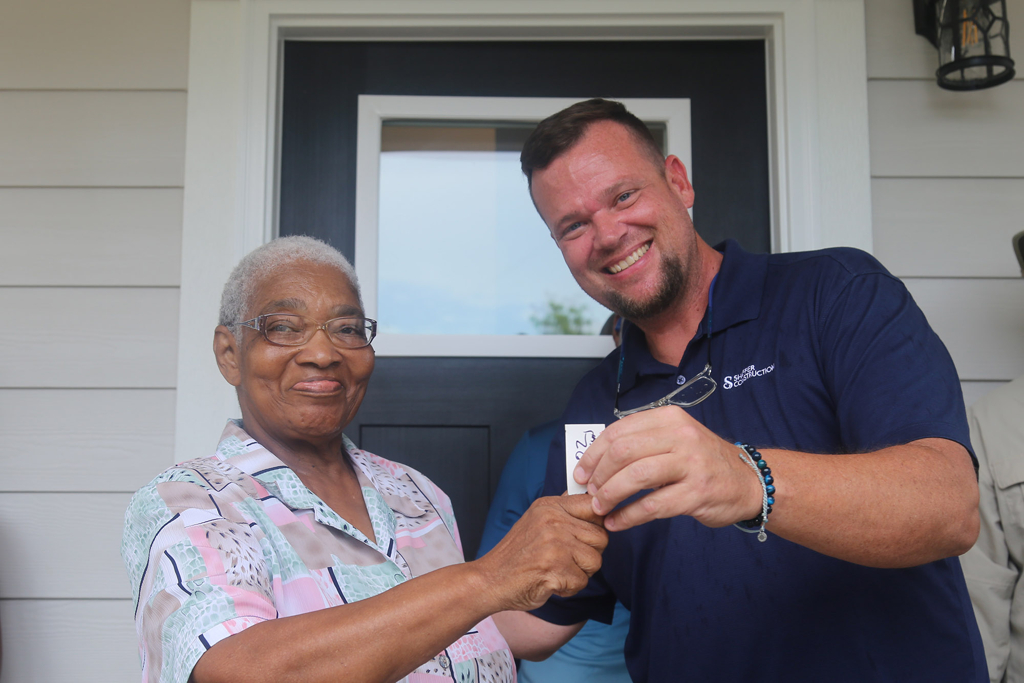 Barbara Stanton and Eric Schaffer as Barbara receives the keys to her new home