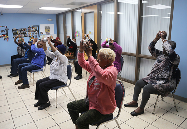 The Brownsville Silver Seniors participate in chair exercises