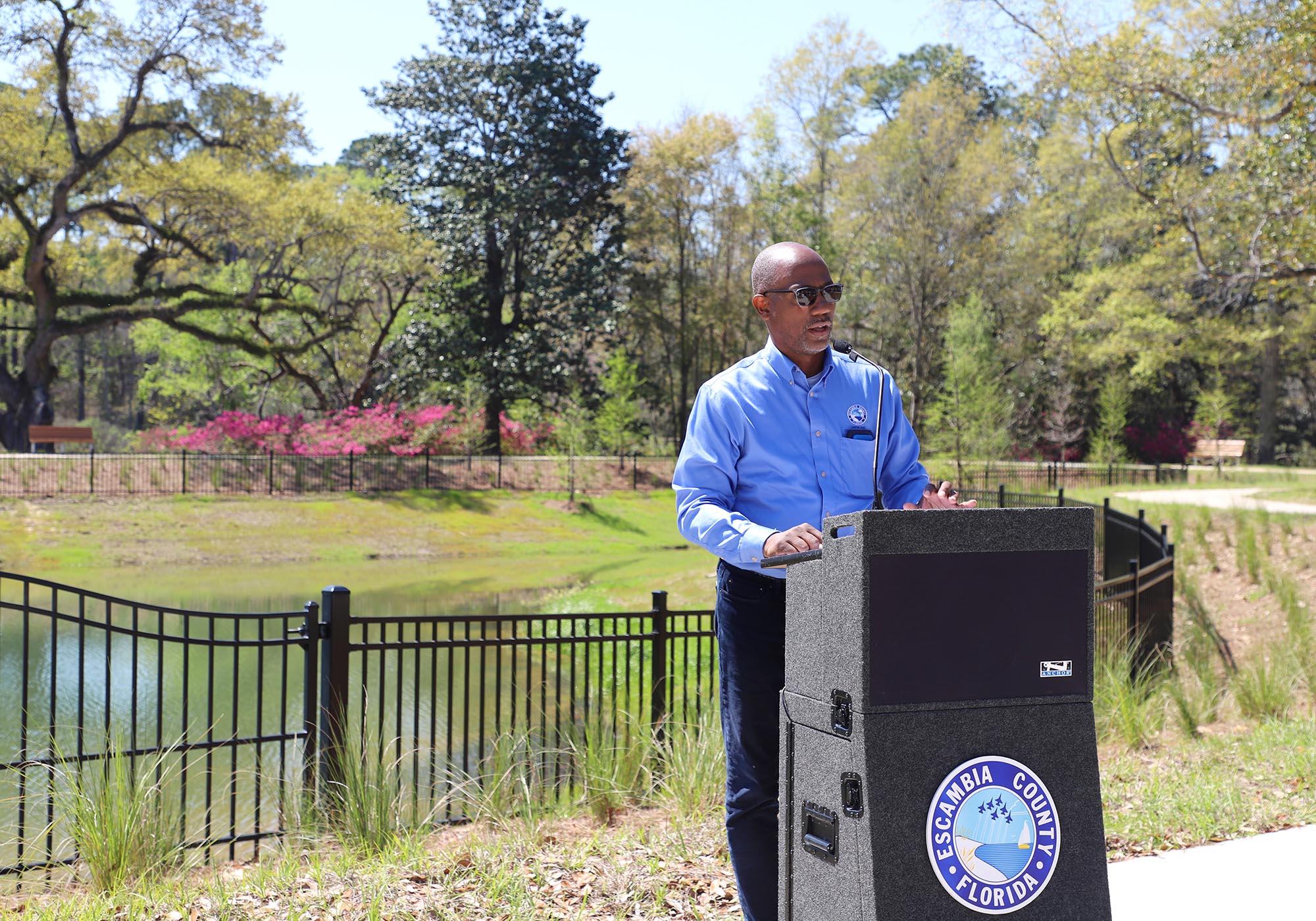 Lumon May speaks during Carpenter Creek Headwaters Creek Ribbon Cutting