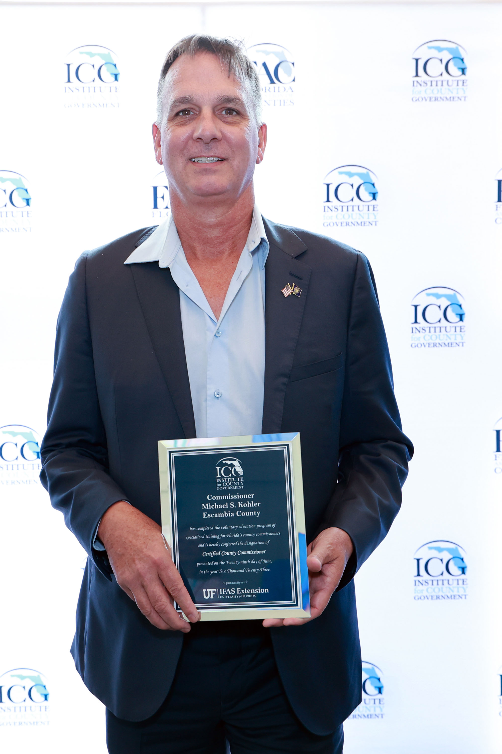 Commissioner Mike Kohler Receives the Certified County Commissioner Award