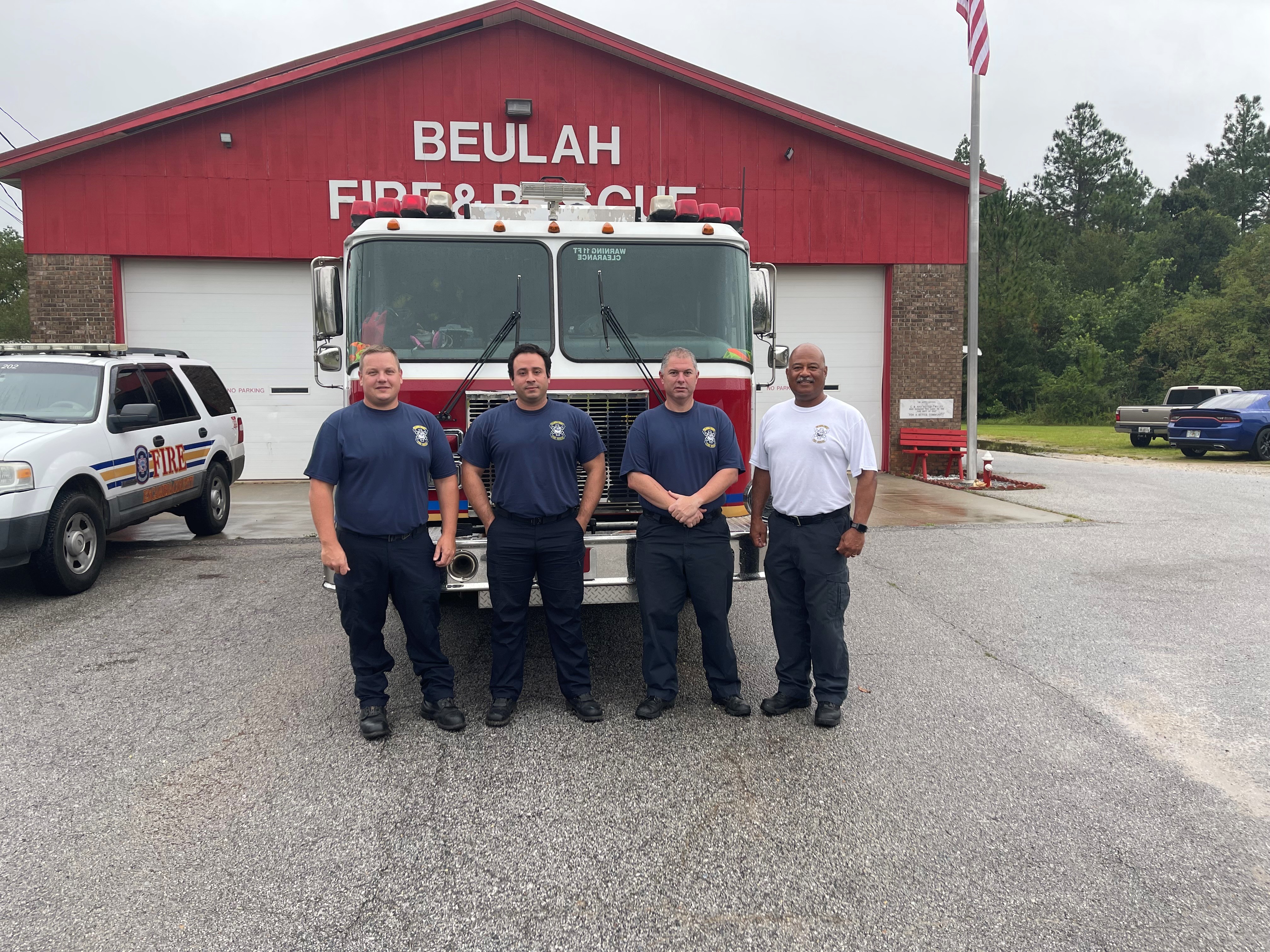 Picture of Chief Core with three firefighters from Station 2.