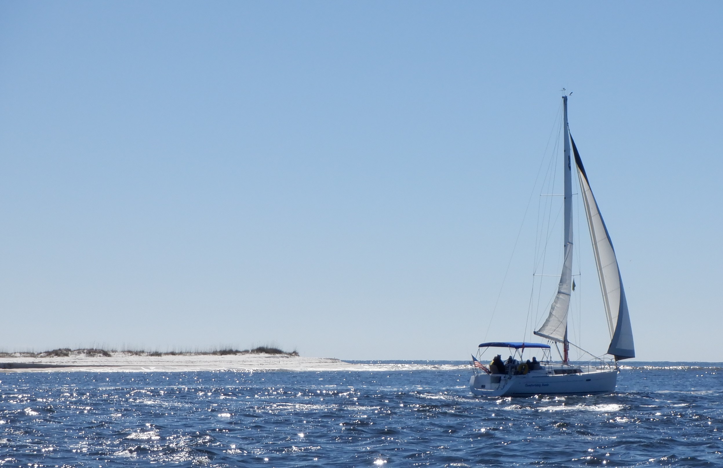 Photo of sail boat out to sea
