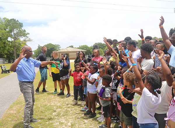 Commissioner May speaking with youth