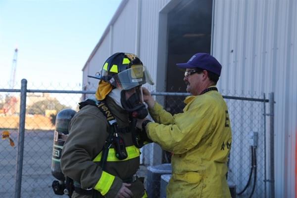 Commissioner Bender dons firefighting gear before training with ECFR Commissioner Bender dons firefighting gear before training with ECFR