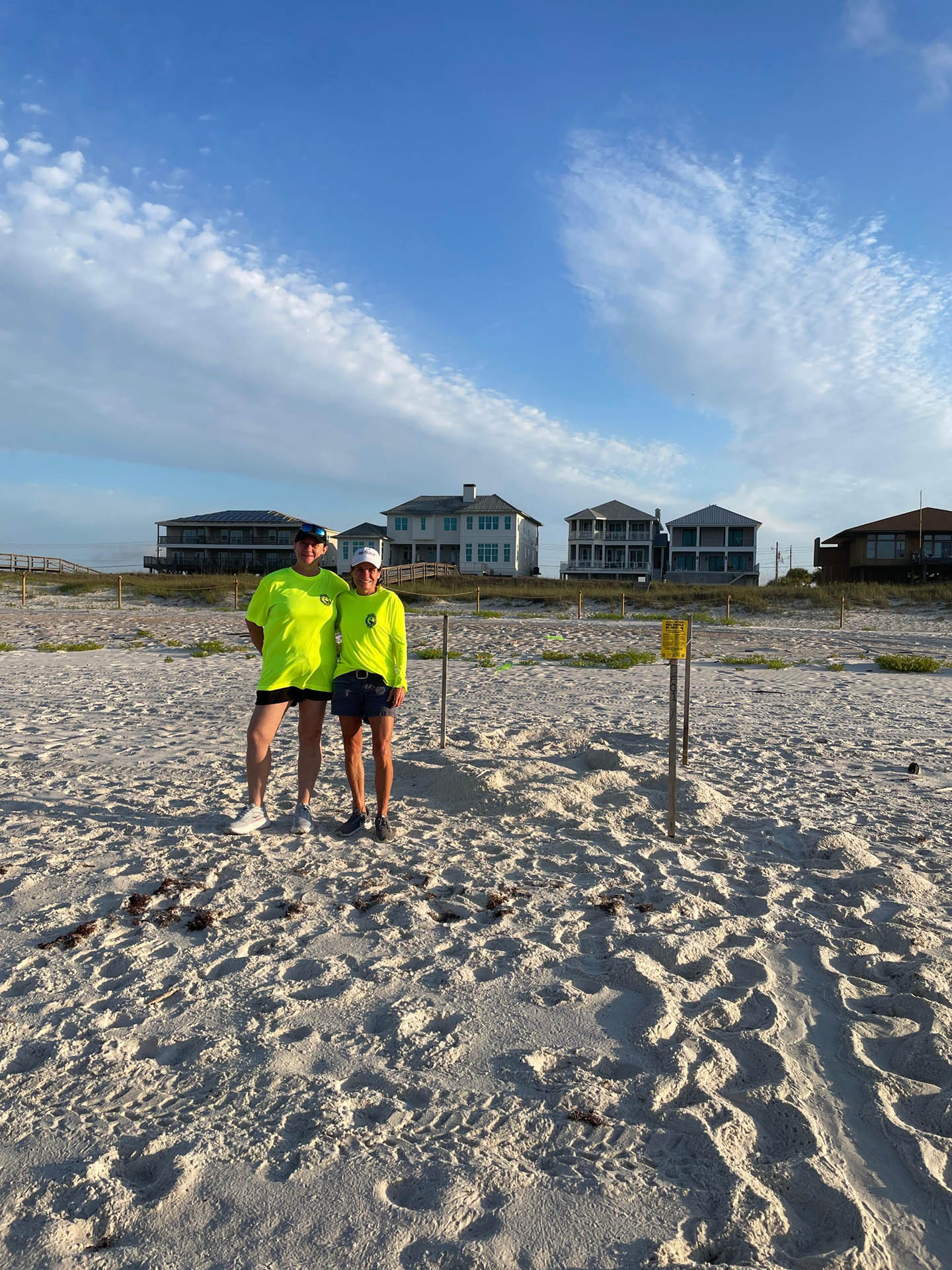 First sea turtle nest on Perdido Key Volunteers standing with the first sea turtle nest on Perdido Key