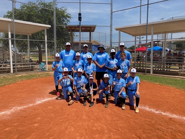 A youth sports team posing after the Gulf Coast Recreation Classic in 2023