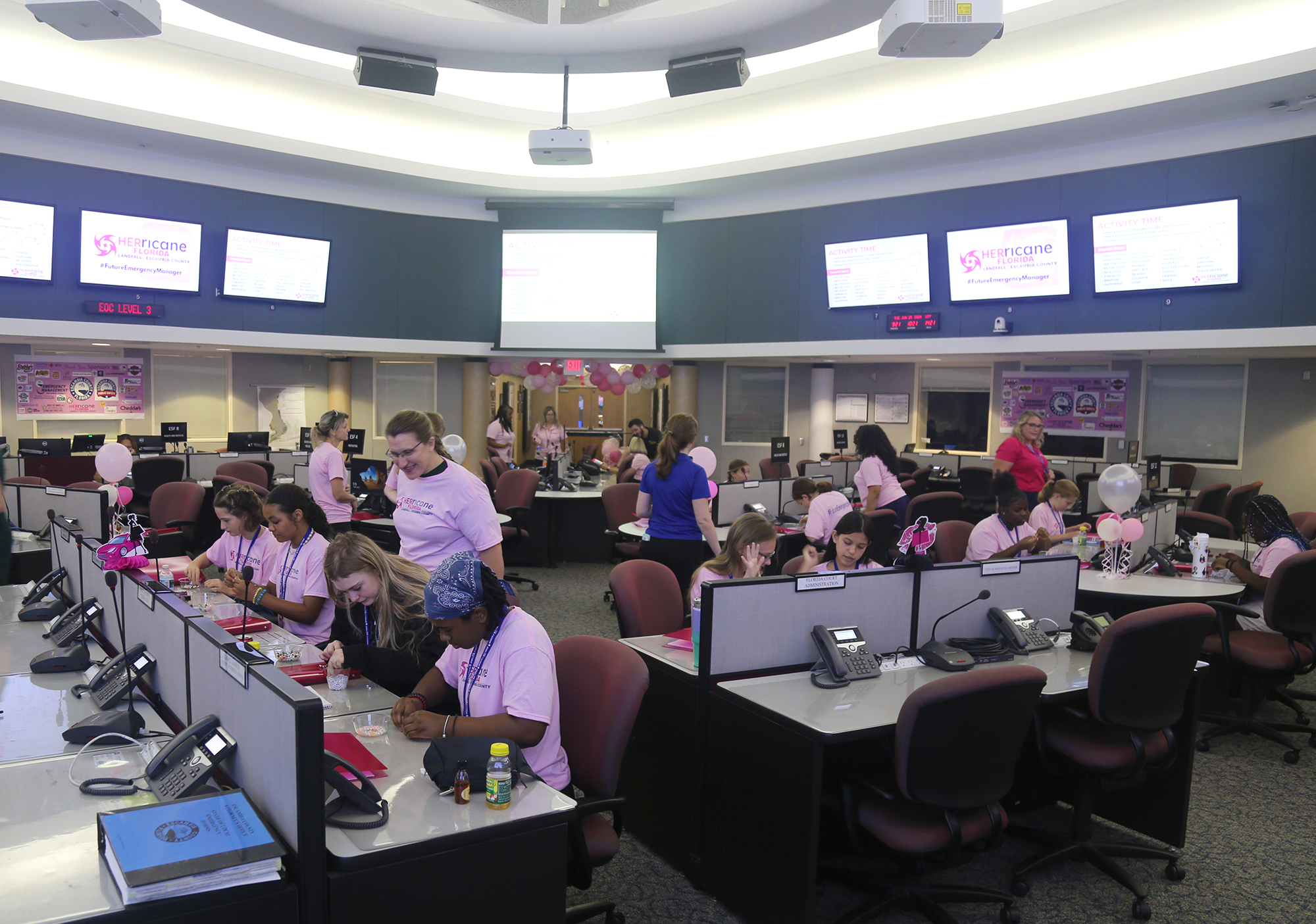 HERricane: Escambia 2025 campers making friendship bracelets
