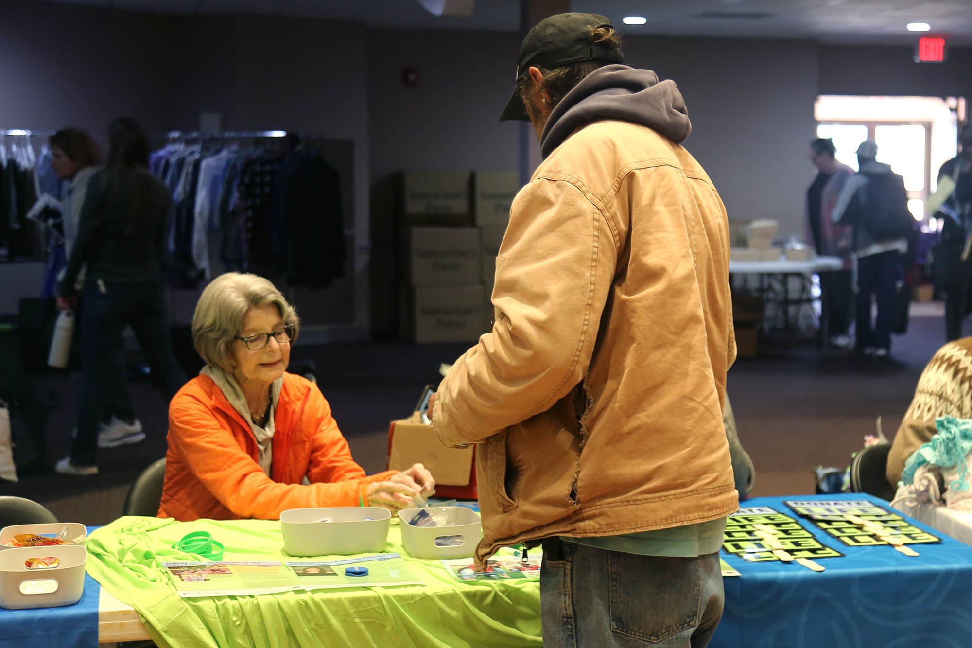 Man and woman at a vendor table