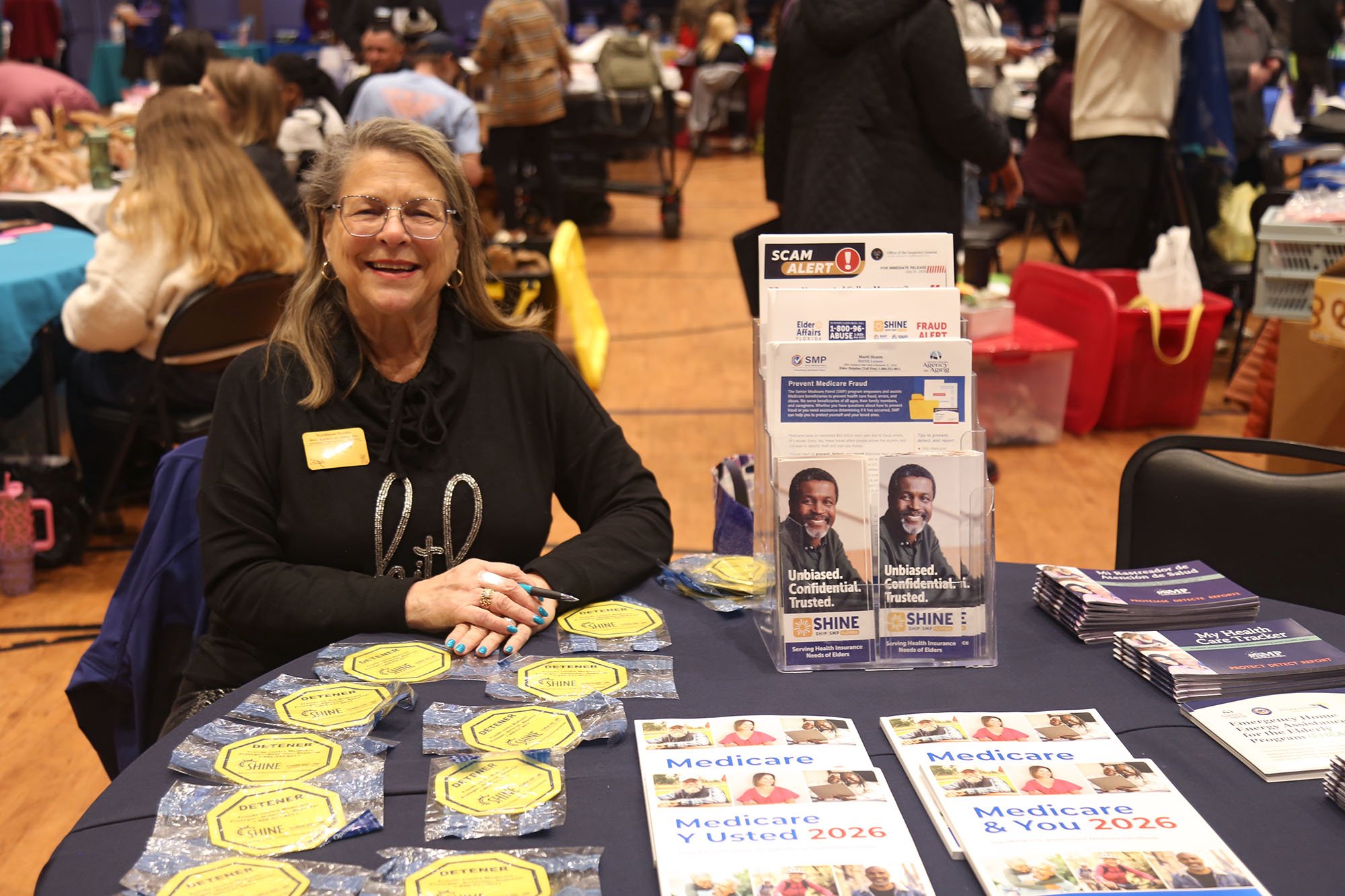 Woman smiling at a table