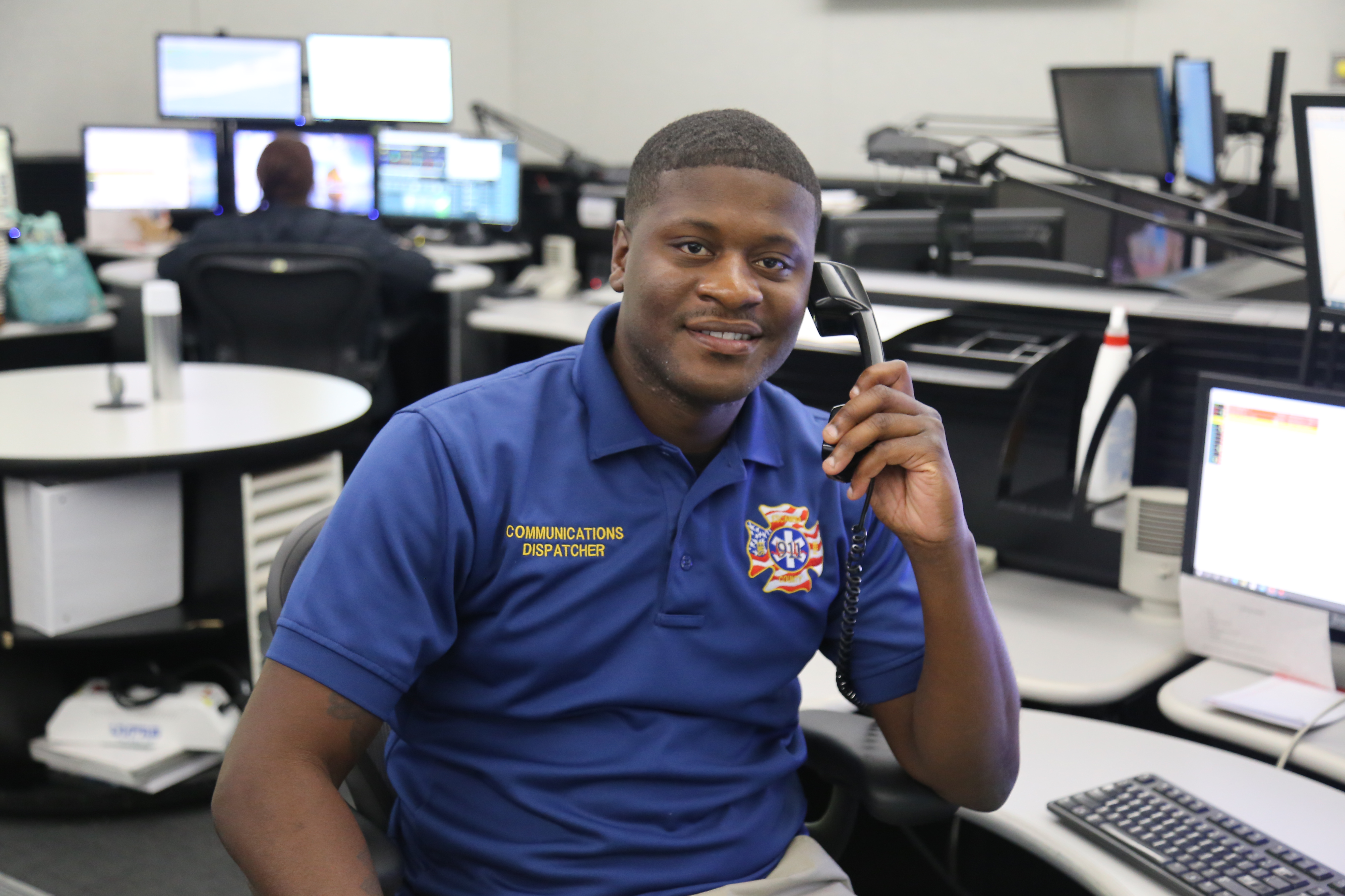 An Escambia County emergency dispatcher taking a call.