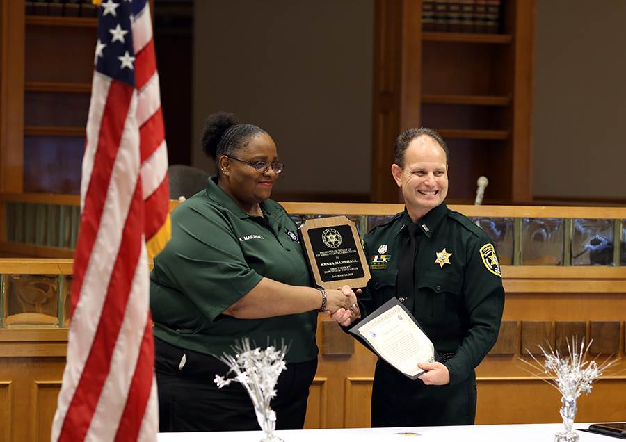 1st Lt. Jason Walker hands out awards at the Aug. 22 Corrections Staff Award Ceremony