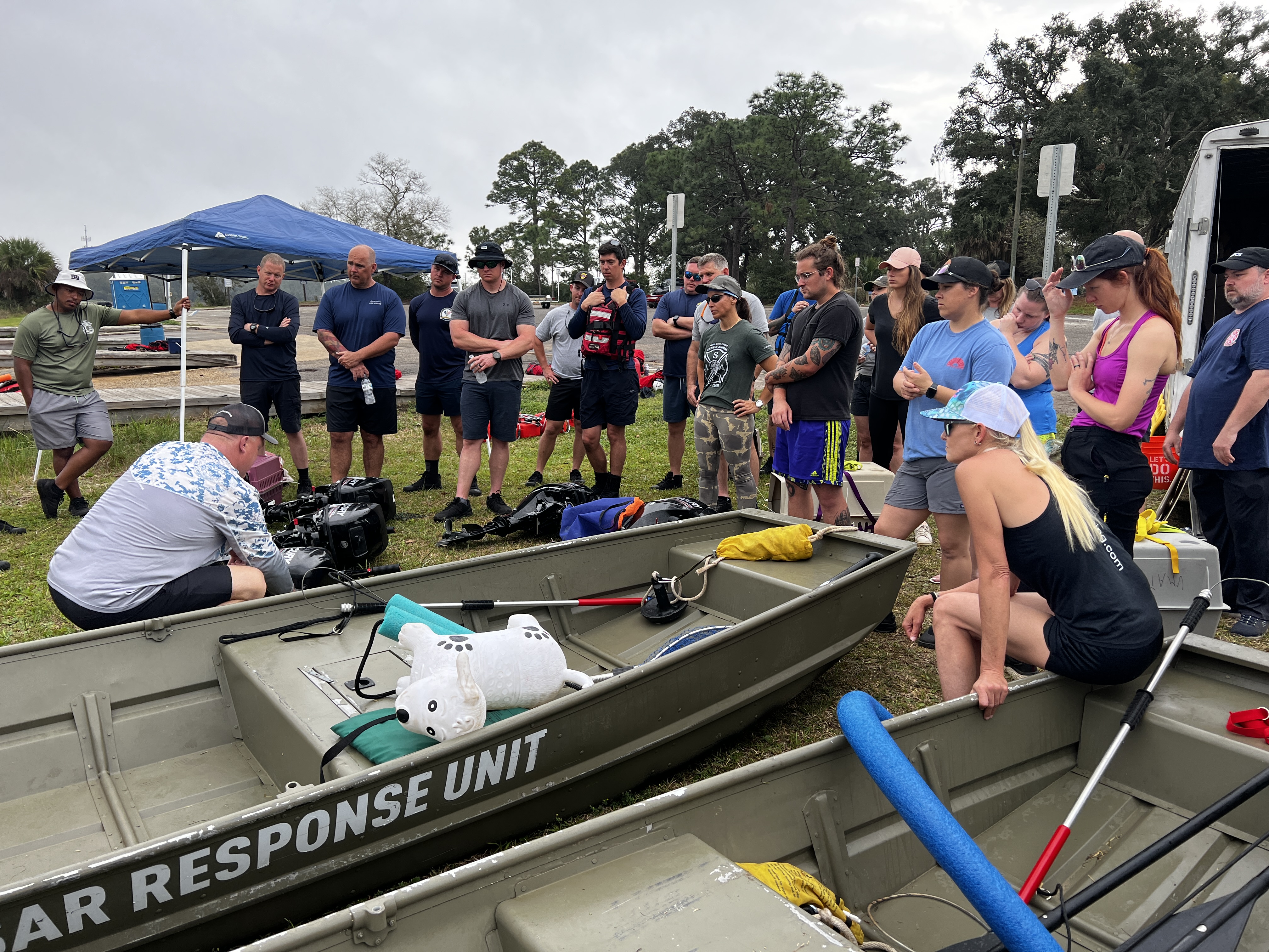 An instructor demonstrates to a group of students during the specialized training