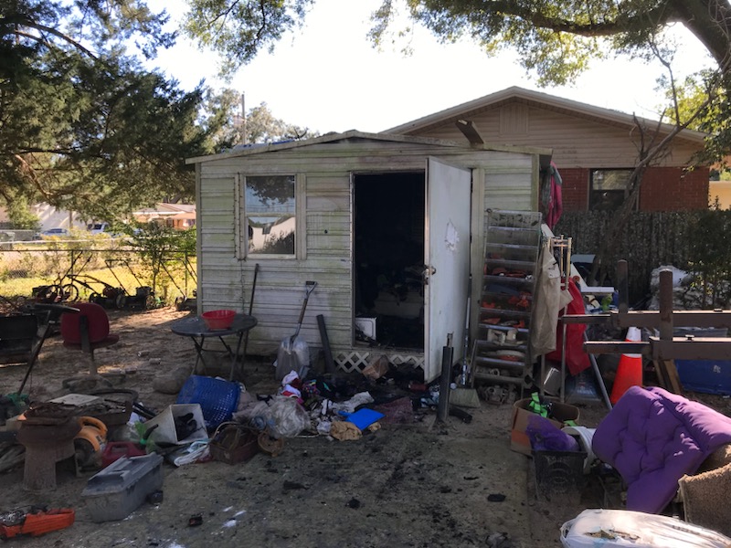 Picture of a fire-damaged shed.