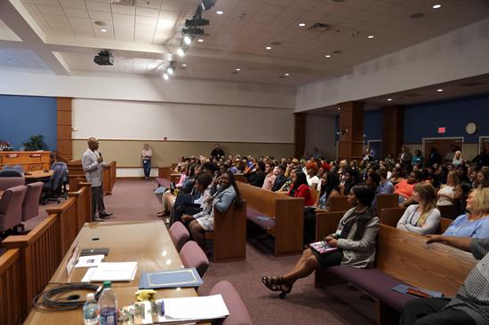 District 3 Commissioner Lumon May addresses the 89 Summer Youth Employment Program participants. 