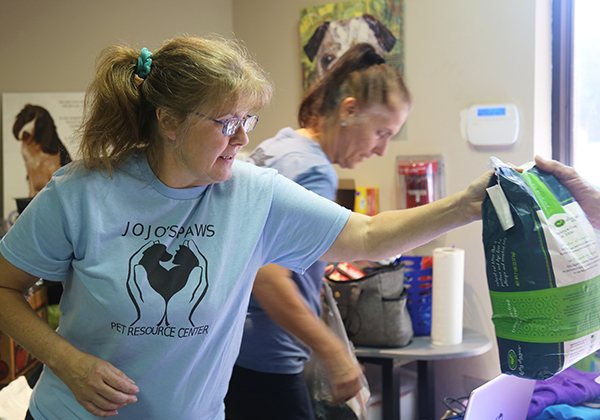 Jo Jo's Paws distributes pet food at Escambia County Animal Welfare