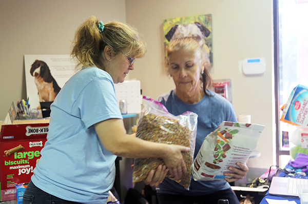 Jo Jo's Paws distributes pet food at Escambia County Animal Welfare