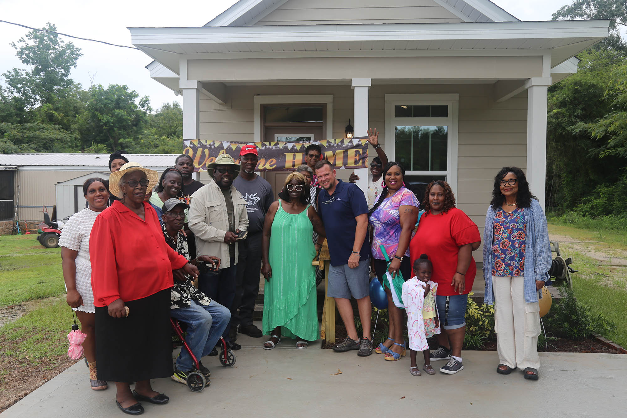 Mary Simpkins celebrates her new home with her family