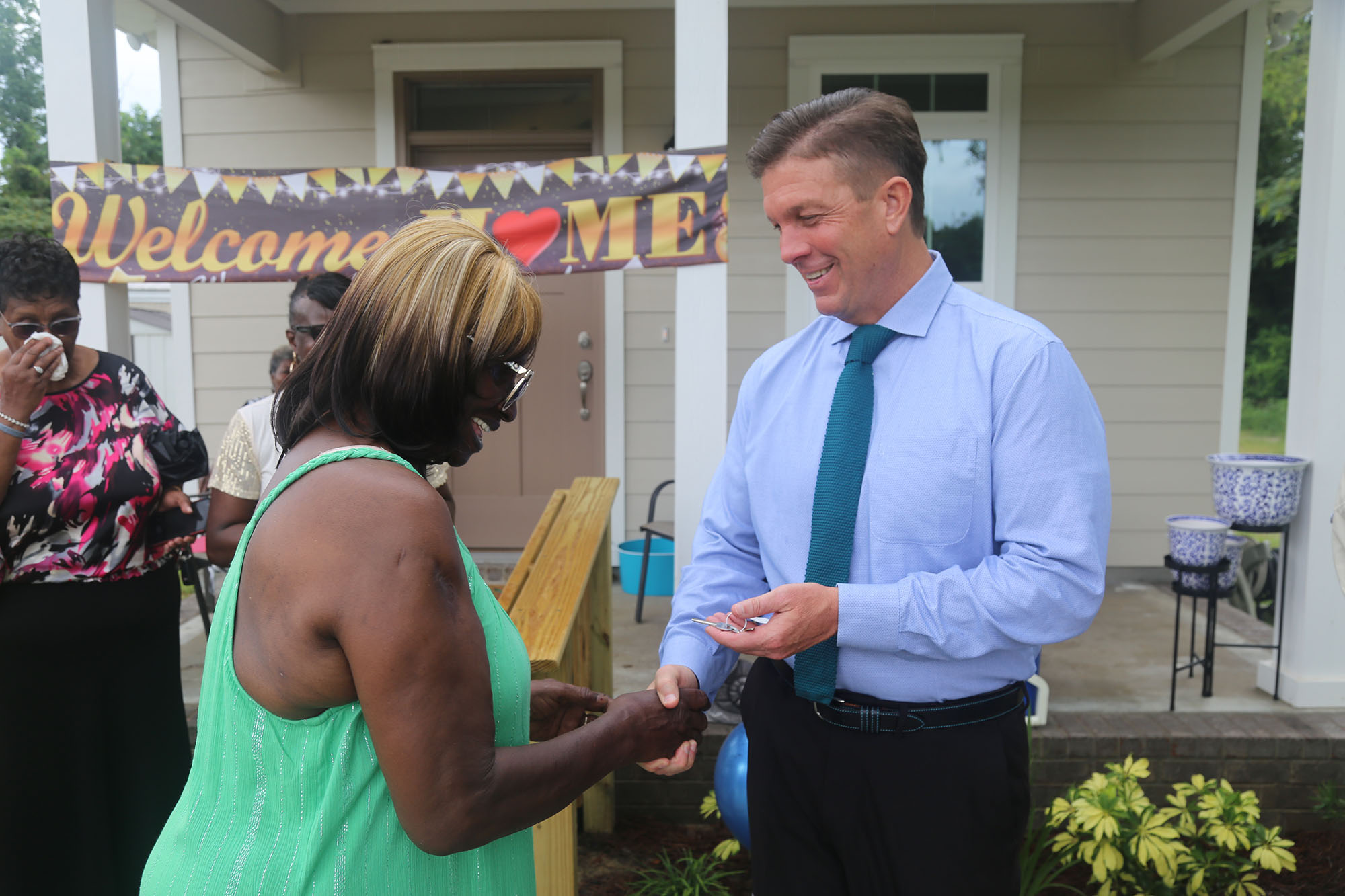 Mary Simpkins receives the keys from Commissioner Steven Barry