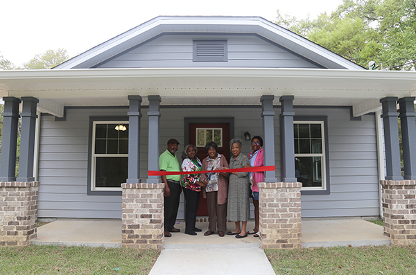 A resident celebrates her new home