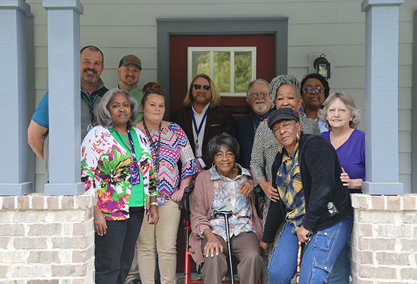 A resident celebrates her new home