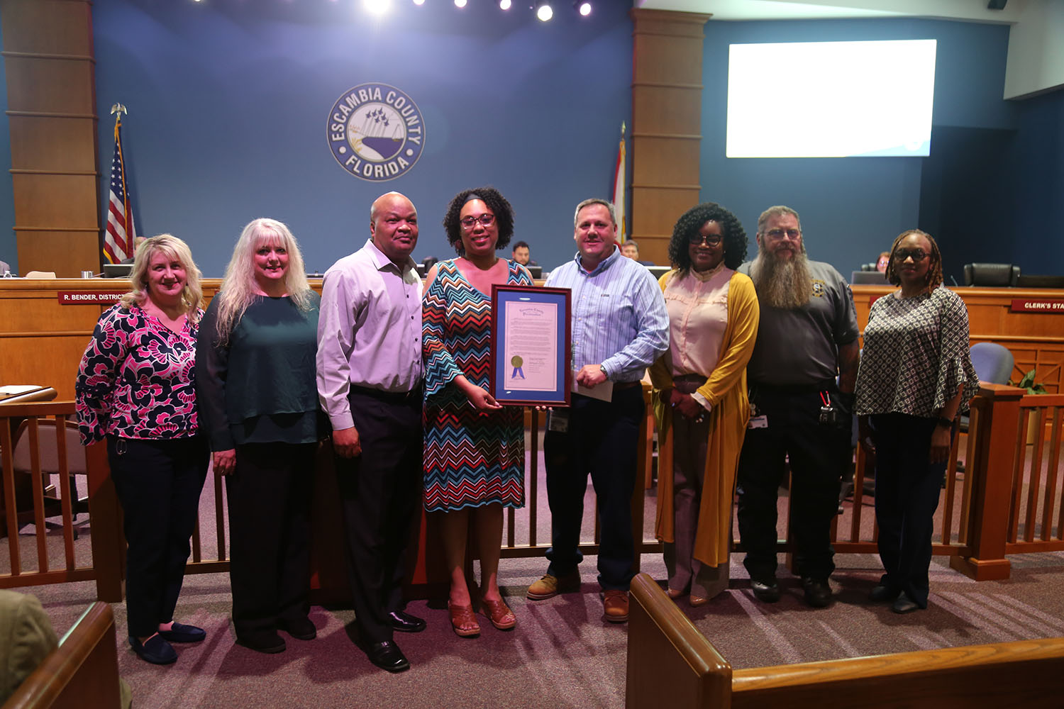 Shandra Jenkins poses for a picture with her EOM proclamation