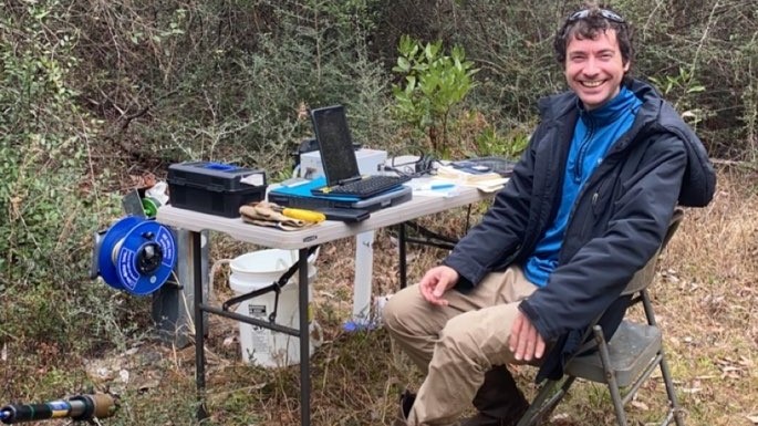 Travis Molony conducting landfill groundwater sampling