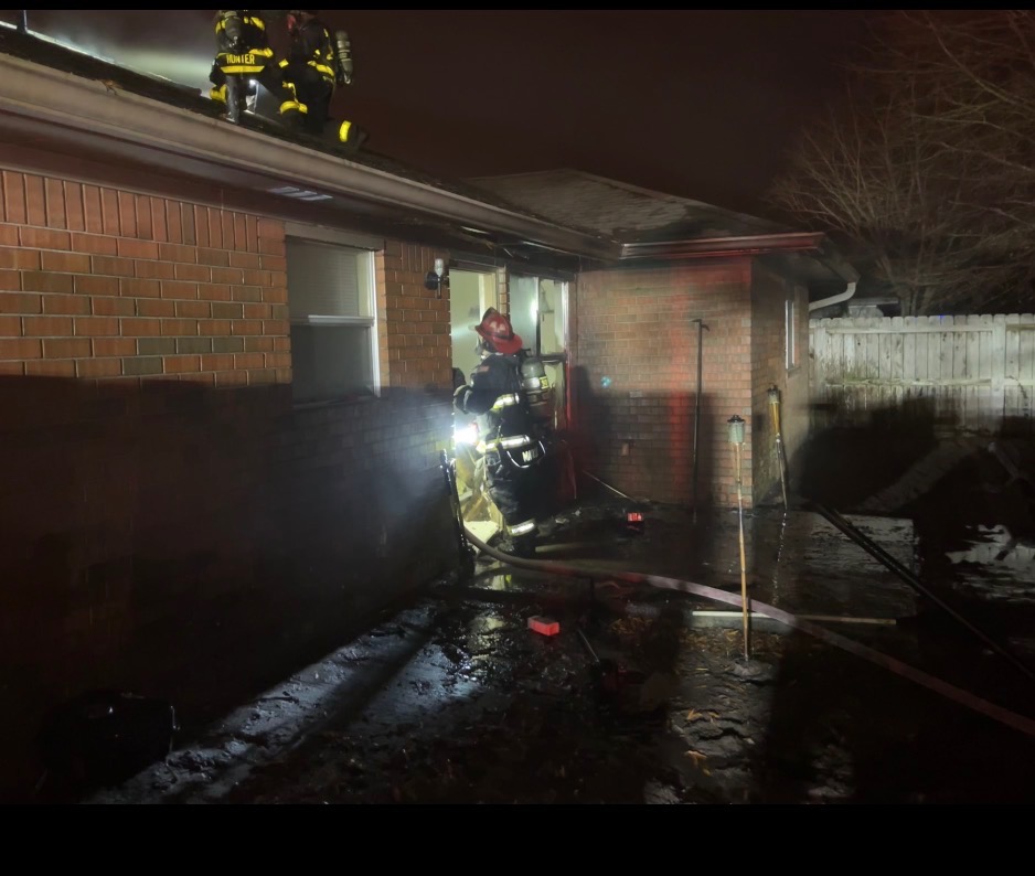 Firefighters responding to a house fire