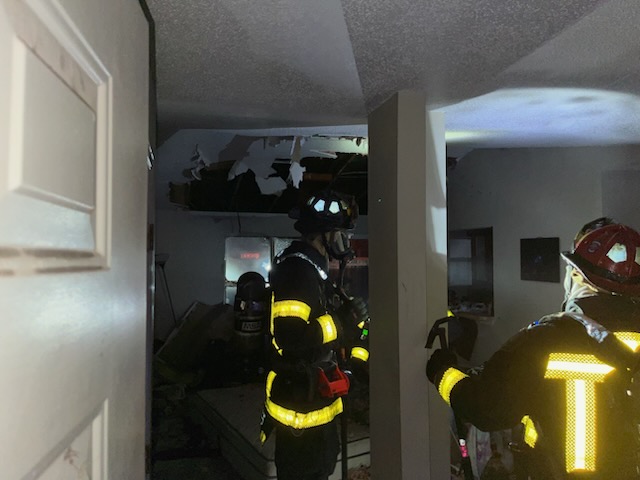 Firefighters responding to house fire