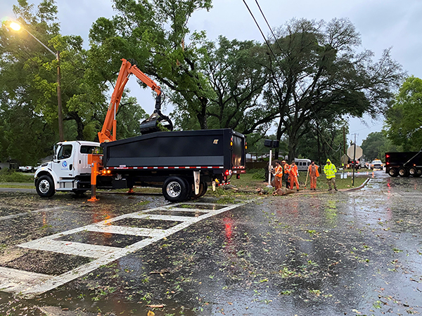 Crews clear an intersection after a tornado