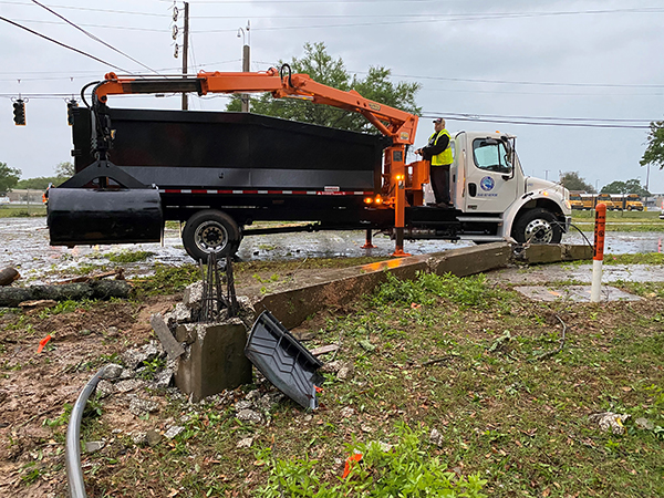 Crews clear an intersection after a tornado