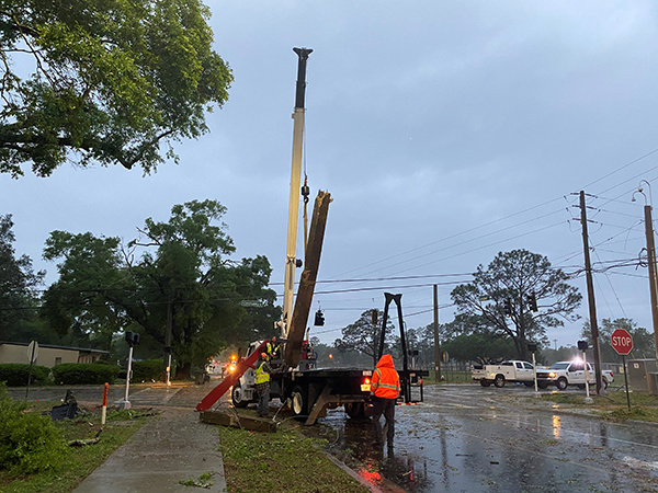 Crews clear an intersection after a tornado