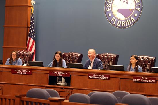 District 1 Commissioner Bergosh and youth commissioners sit at the dais for the first youth commission meeting Tuesday, Sept. 17.